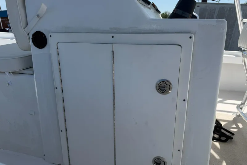 Slide: The Image of 1974 Boca Grande Passmaster 26 boat console with storage compartment and latch. - 21