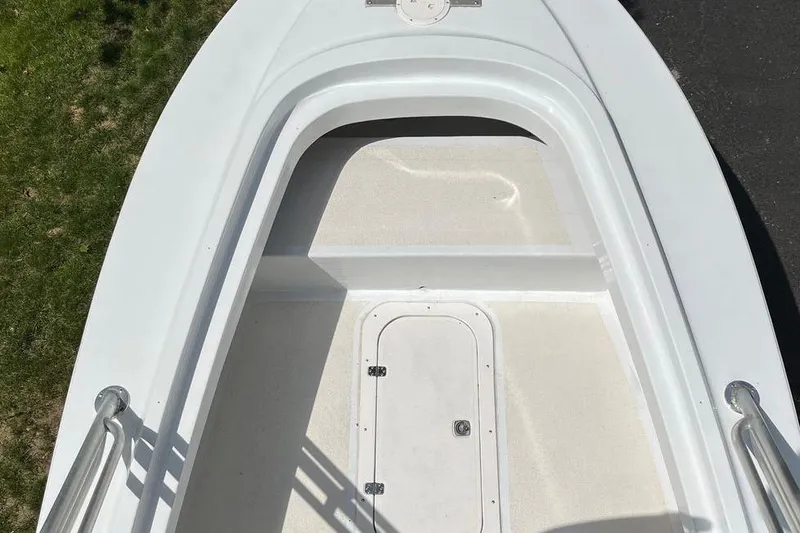 Slide: The Image of 1974 Boca Grande Passmaster 26 boat deck, white with storage hatch, viewed from above. - 25