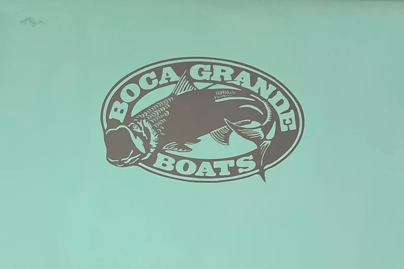 Slide: The Image of Logo of Boca Grande Boats featuring a fish, on a 1974 Passmaster 26. - 3
