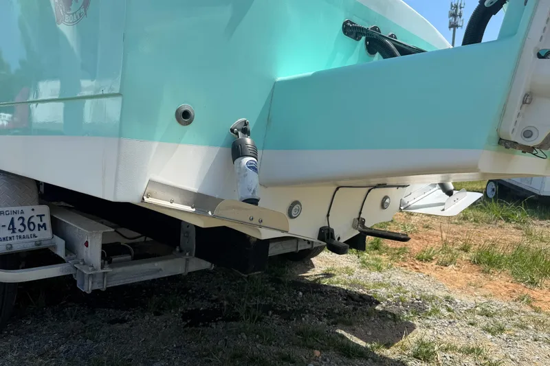 Slide: The Image of 1974 Boca Grande Passmaster 26 boat on trailer, showing rear hull and Virginia license plate. - 6