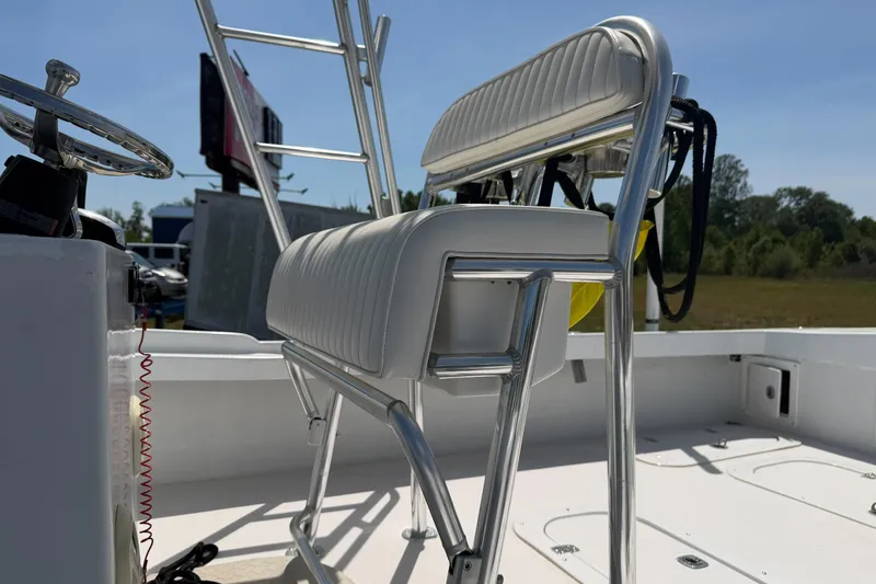 Slide: The Image of 1974 Boca Grande Passmaster 26 boat interior with steering wheel and seating. - 8