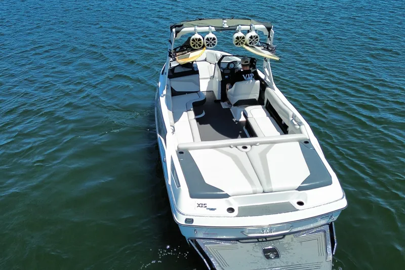 Slide: The Image of 2017 Axis T23 boat on water, featuring sleek design and wakeboard tower. - 11