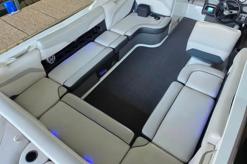 Slide: The Image of 2017 Axis T23 boat interior with spacious seating and modern dashboard. - 13