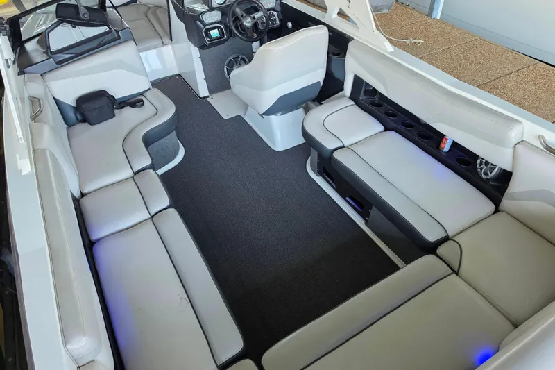 Slide: The Image of 2017 Axis T23 boat interior with spacious seating and modern dashboard. - 14