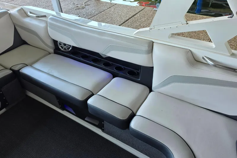 Slide: The Image of Interior seating of 2017 Axis T23 boat with cup holders and speaker. - 17
