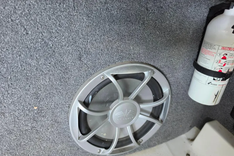 Slide: The Image of Speaker and fire extinguisher in 2017 Axis T23 boat interior. - 21