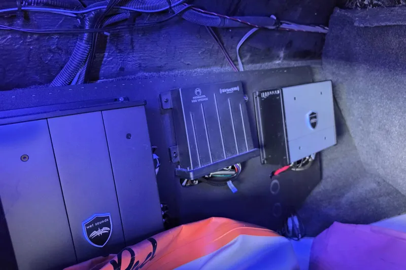 Slide: The Image of Audio equipment installation in a 2017 Axis T23 boat, featuring Wet Sounds amplifiers. - 27