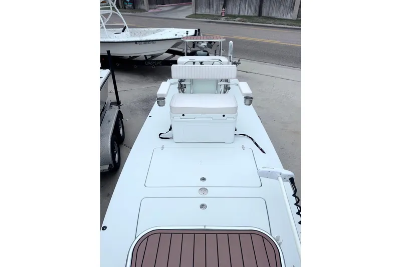 Slide: The Image of 2016 East Cape Fury boat with seating and storage, parked on a trailer. - 13