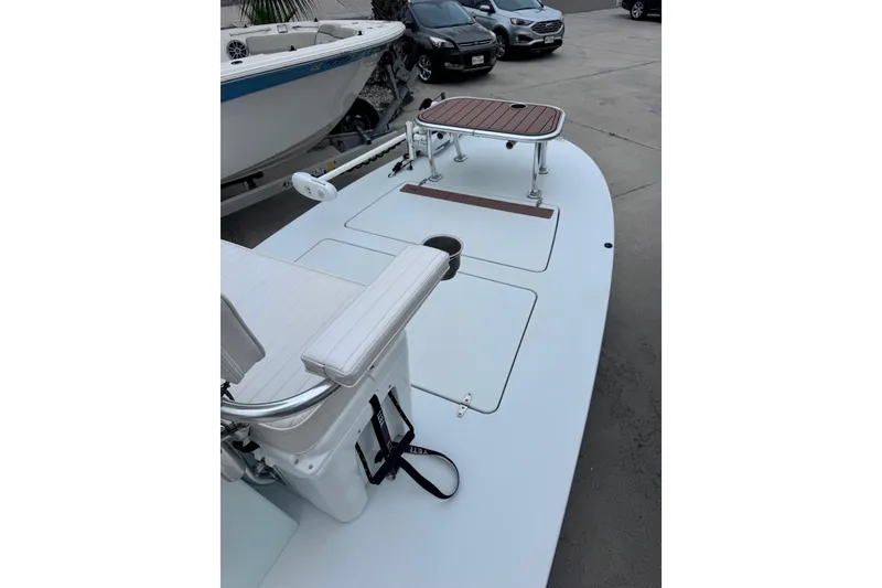 Slide: The Image of 2016 East Cape Fury boat deck with seating and storage compartments. - 15