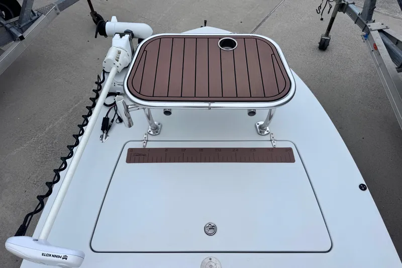 Slide: The Image of 2016 East Cape Fury boat deck with trolling motor and measuring ruler. - 16