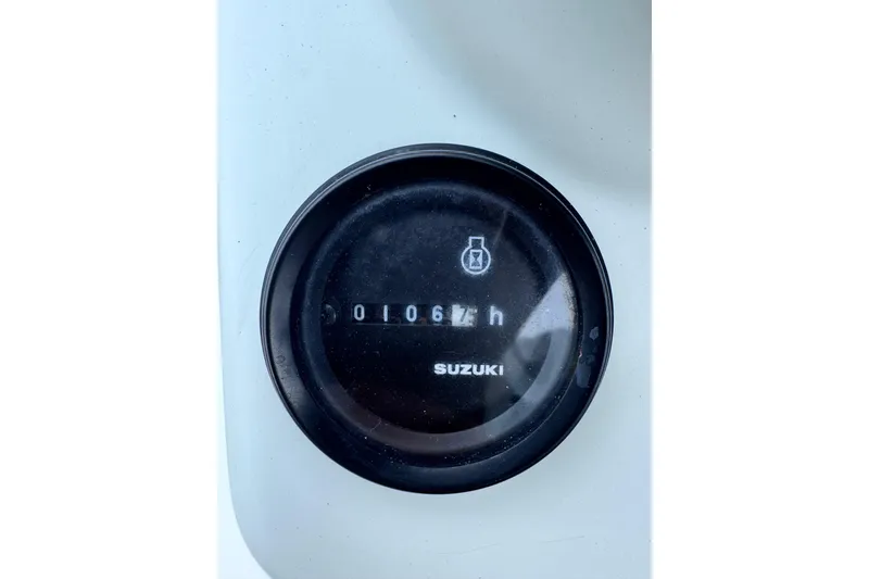 Slide: The Image of Hour meter on 2016 East Cape Fury boat, displaying 106 hours, Suzuki branding visible. - 24