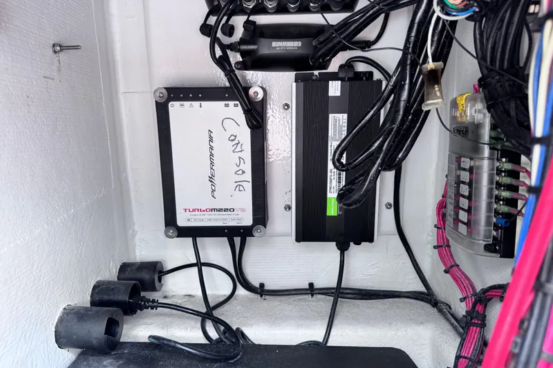 Slide: The Image of Electrical components and wiring inside a 2016 East Cape Fury boat console. - 26