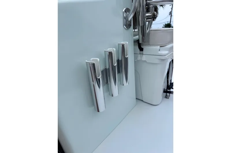 Slide: The Image of 2016 East Cape Fury boat with chrome rod holders and console details. - 27