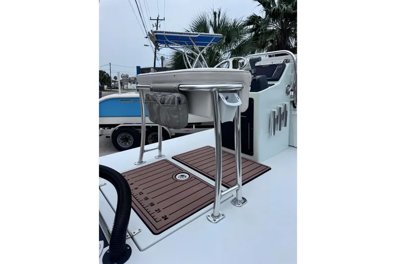 Slide: The Image of 2016 East Cape Fury boat deck with seating and control panel. - 29