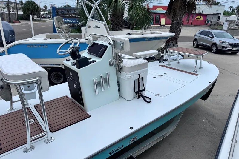 Slide: The Image of 2016 East Cape Fury boat with sleek design, white seating, and modern console controls. - 3