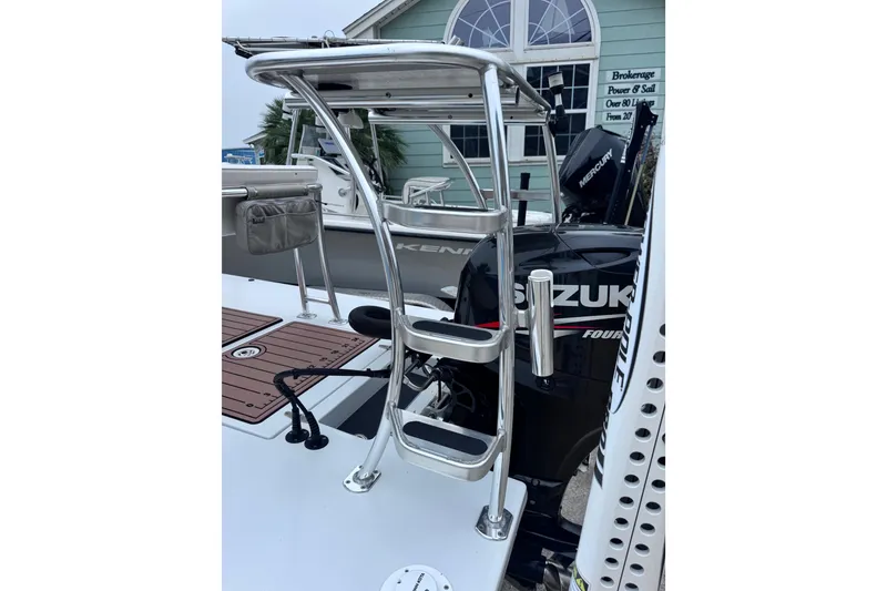 Slide: The Image of 2016 East Cape Fury boat with Suzuki outboard motor and aluminum ladder. - 32