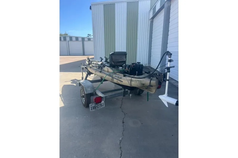 Slide: The Image of 2016 East Cape Fury boat on trailer, parked outside a storage facility. - 39