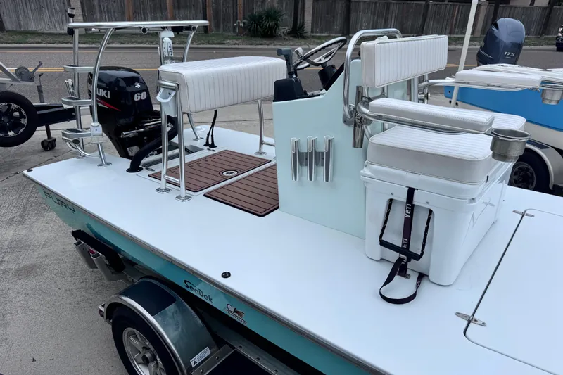 Slide: The Image of 2016 East Cape Fury boat with Suzuki 60 engine, featuring a sleek deck and seating. - 4