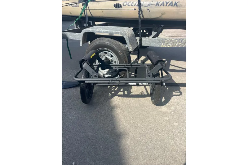 Slide: The Image of Kayak trailer with wheels beside East Cape Fury 2016 boat on concrete surface. - 41