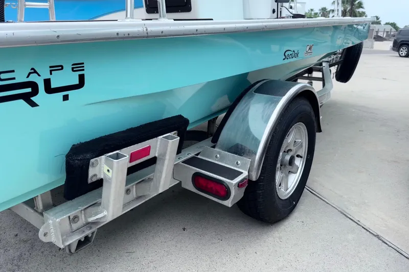 Slide: The Image of 2016 East Cape Fury boat on trailer, featuring sleek design and SeaDek padding. - 8