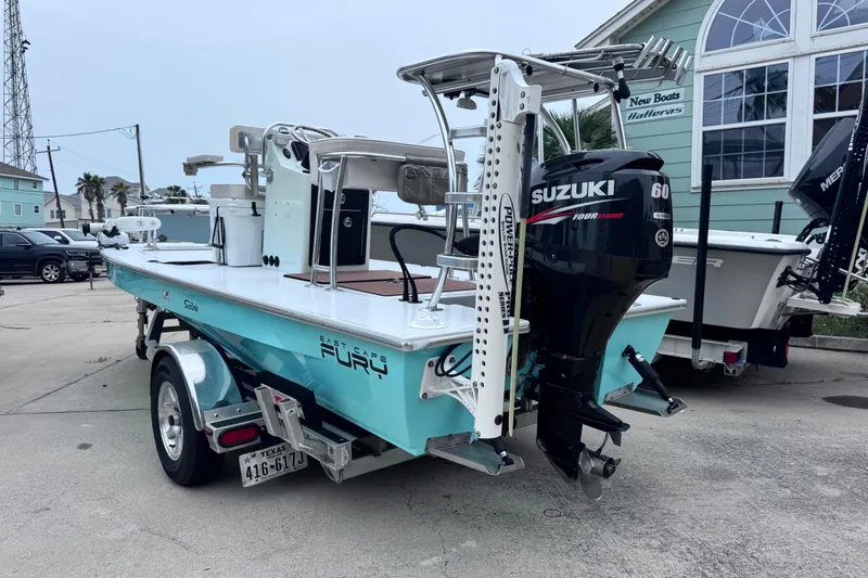 Slide: The Image of 2016 East Cape Fury boat with Suzuki 60 engine on trailer, parked outdoors. - 9