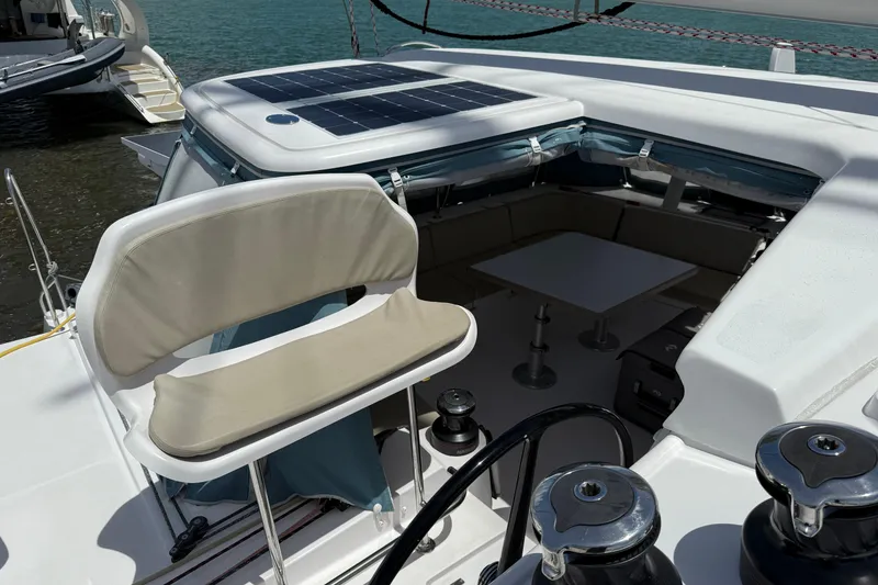 Slide: The Image of 2022 Outremer 51 yacht cockpit with seating, table, and solar panel. - 10