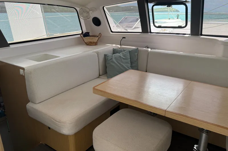 Slide: The Image of Interior of 2022 Outremer 51 catamaran with cozy seating and dining area. - 12