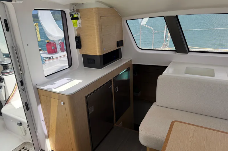 Slide: The Image of Interior of 2022 Outremer 51 yacht with modern kitchen and seating area. - 13