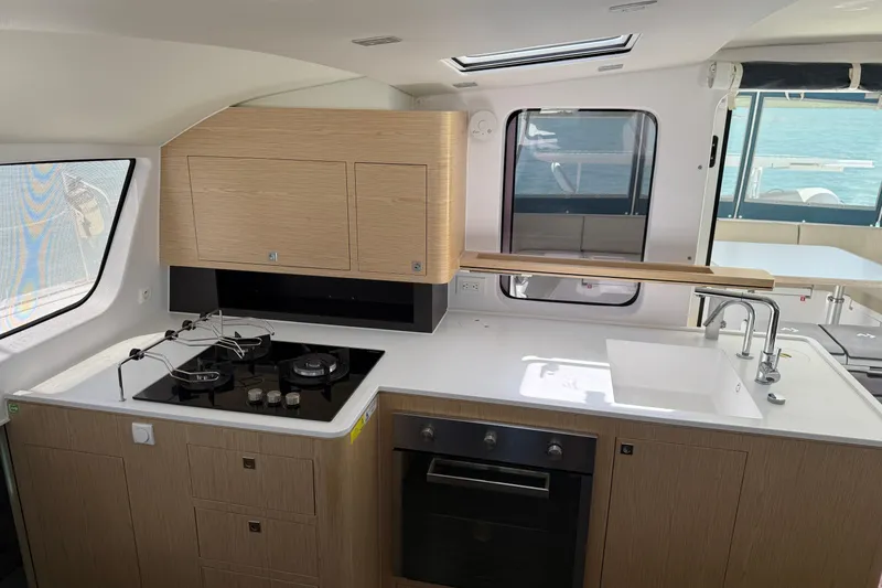 Slide: The Image of Modern kitchen interior of 2022 Outremer 51 yacht with stove, oven, and sink. - 15