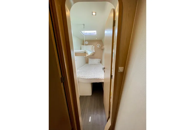 Slide: The Image of Cozy cabin interior of 2022 Outremer 51 yacht with bed and skylight. - 19