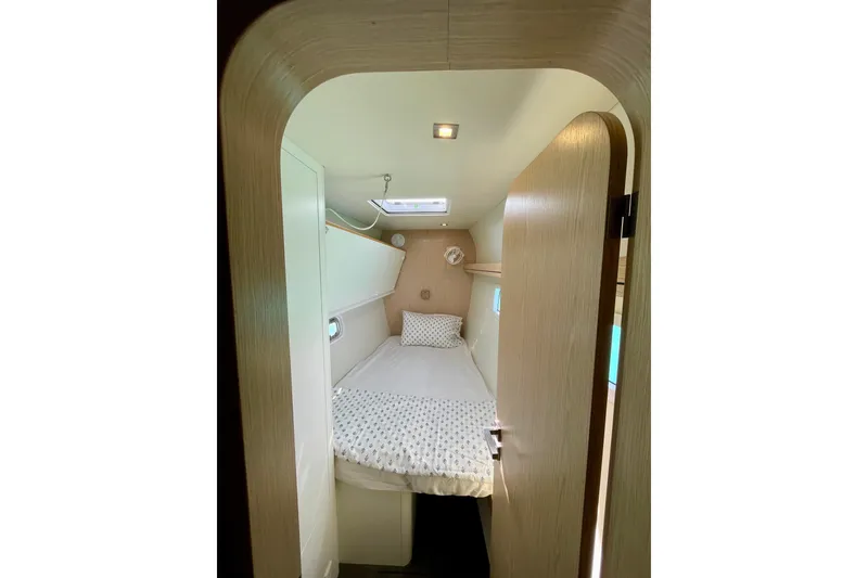 Slide: The Image of Cozy cabin interior of 2022 Outremer 51 yacht with modern design and comfortable bedding. - 20