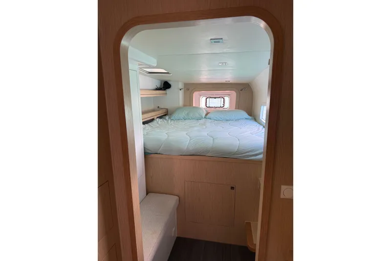 Slide: The Image of Cozy cabin interior of 2022 Outremer 51 yacht with a neatly made bed. - 22