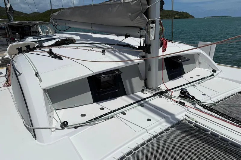 Slide: The Image of 2022 Outremer 51 catamaran deck with rigging, sails, and ocean backdrop. - 5