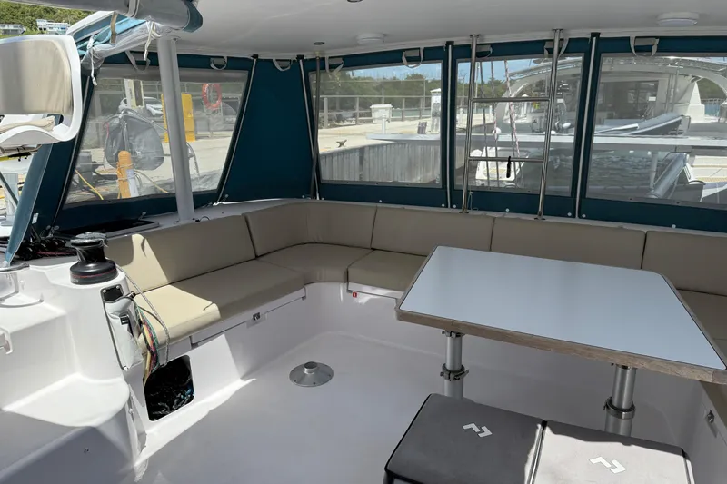 Slide: The Image of Interior of 2022 Outremer 51 catamaran with seating and table in cockpit area. - 8