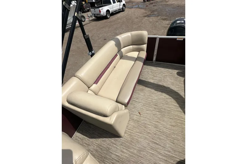 Slide: The Image of Beige seating on 2022 Godfrey Sweetwater 2286 SB pontoon boat, outdoor setting. - 14