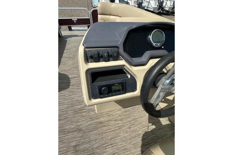 Slide: The Image of Steering console of 2022 Godfrey Sweetwater 2286 SB pontoon boat with controls and gauges. - 17