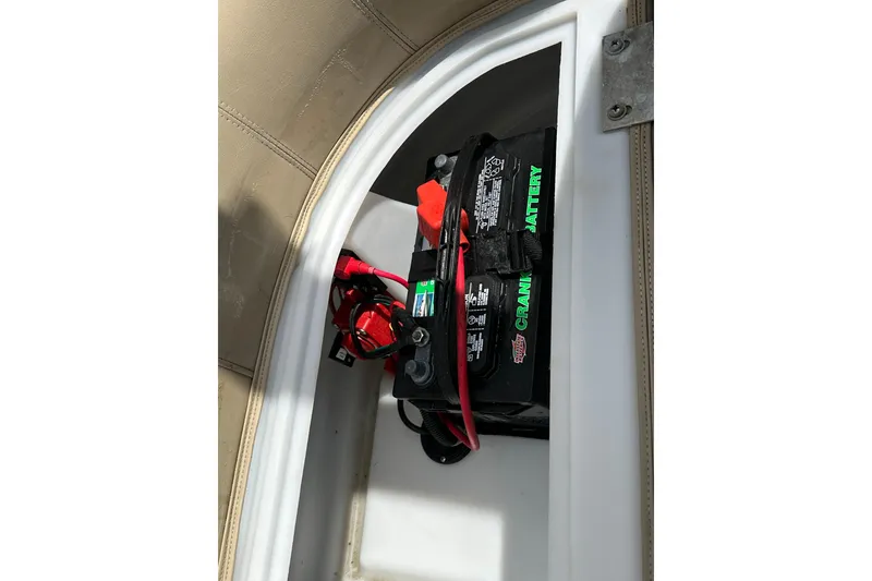 Slide: The Image of Battery compartment of 2022 Godfrey Sweetwater 2286 SB boat with visible wiring. - 18