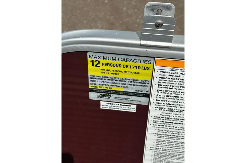 Slide: The Image of Capacity label on 2022 Godfrey Sweetwater 2286 SB boat, max 12 persons or 1710 lbs. - 20