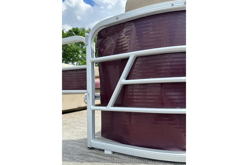 Slide: The Image of 2022 Godfrey Sweetwater 2286 SB pontoon boat railing detail under blue sky. - 21