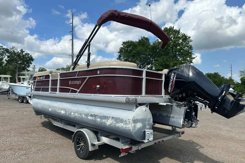 Slide: The Image of 2022 Godfrey Sweetwater 2286 SB pontoon boat on trailer, featuring Mercury outboard motor. - 4
