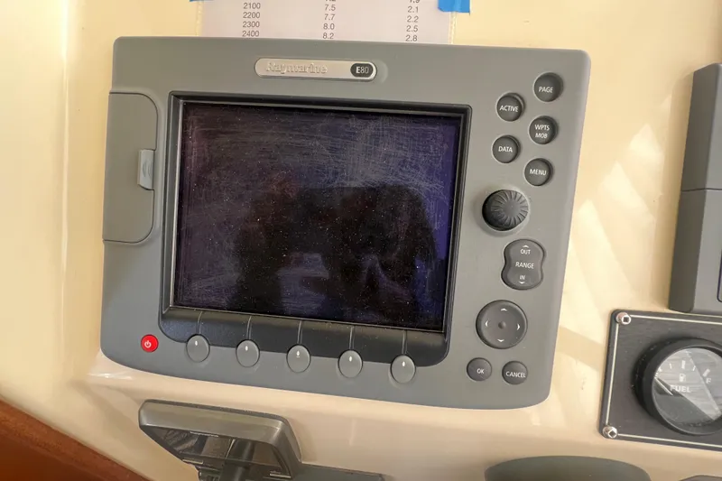 Slide: The Image of Navigation system on a 2005 Camano Trawler boat dashboard. - 28