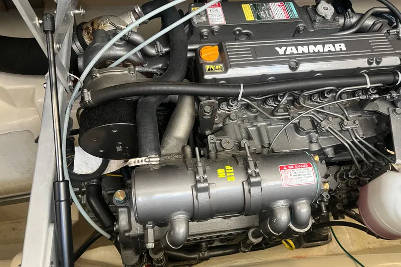 Slide: The Image of Engine of a 2005 Camano Trawler with Yanmar branding visible. - 34