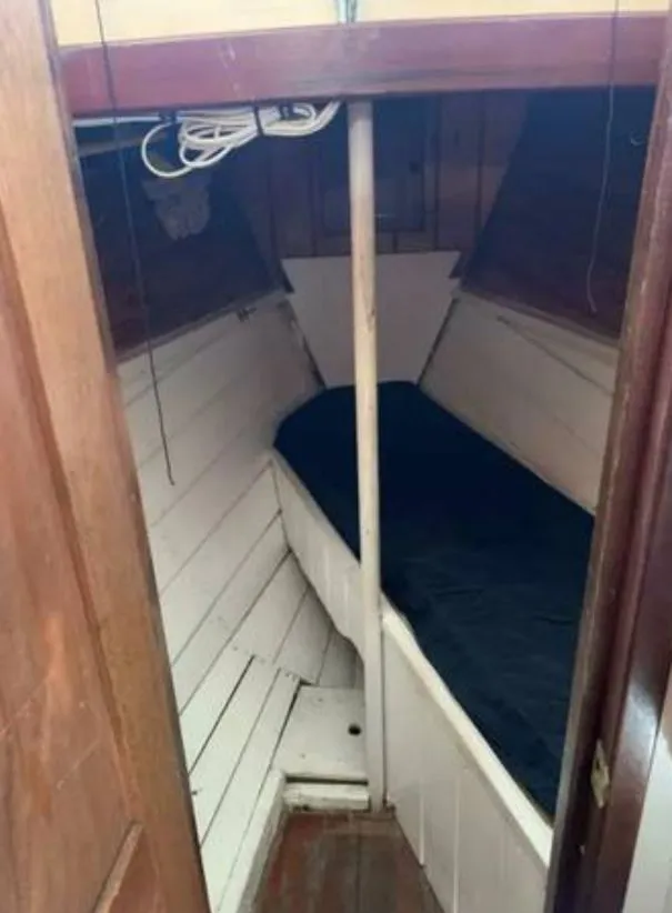 Slide: The Image of Interior of a 1979 Colvin Gazelle yacht with wooden paneling. - 10