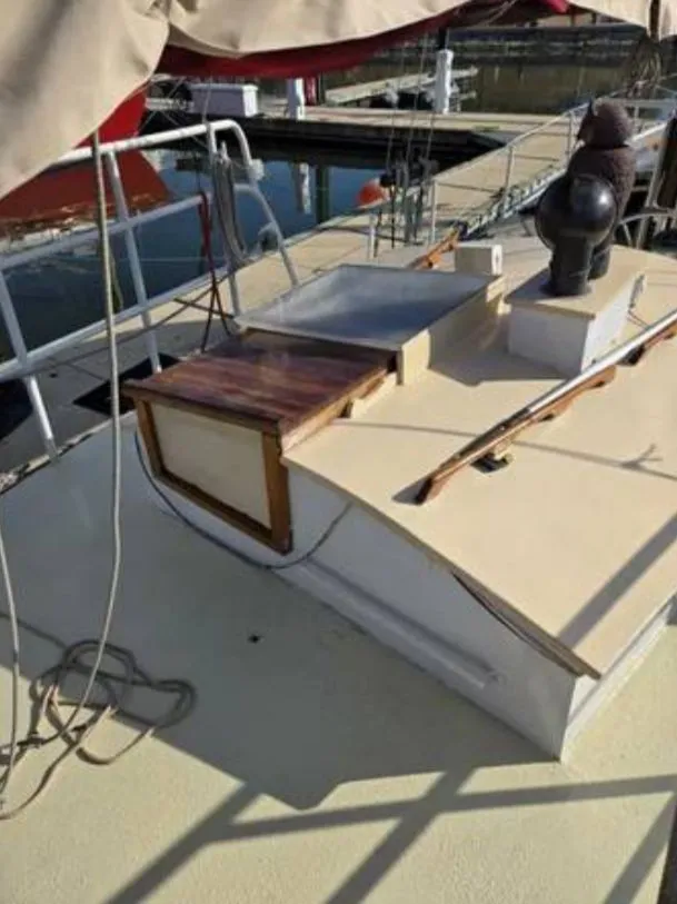 Slide: The Image of 1979 Colvin Gazelle deck with wooden details and harbor view. - 13