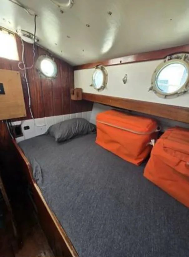 Slide: The Image of Interior of a 1979 Colvin Gazelle with bed and portholes. - 3