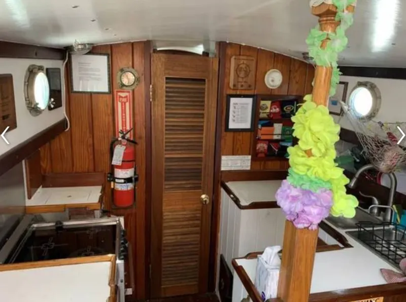 Slide: The Image of Interior of a 1979 Colvin Gazelle yacht with wooden decor. - 6