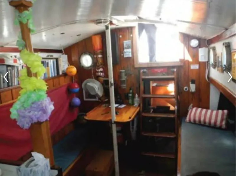 Slide: The Image of Interior of a 1979 Colvin Gazelle yacht with wooden furnishings. - 8