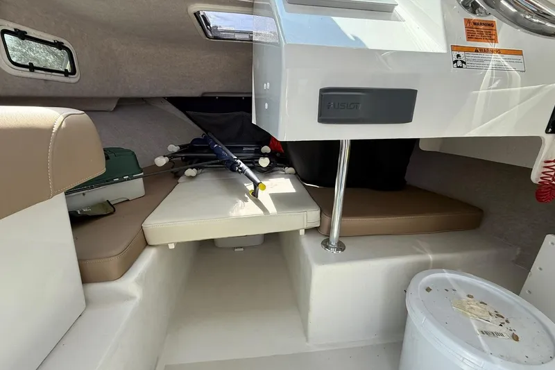 Slide: The Image of Interior of a 2019 Parker 2150 boat with fishing gear and seating area. - 10