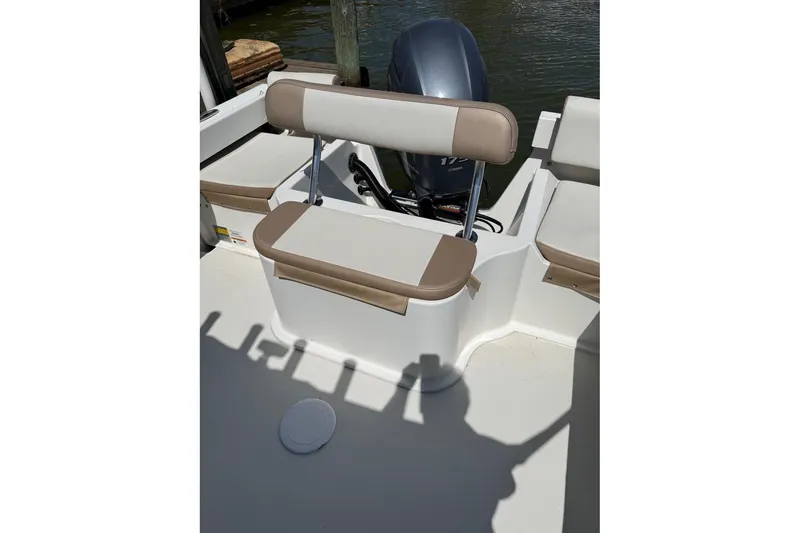 Slide: The Image of 2019 Parker 2150 boat interior with seating and motor view. - 15