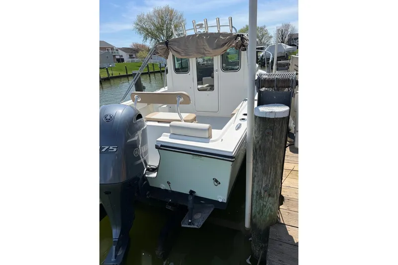 Slide: The Image of 2019 Parker 2150 boat docked with Yamaha 175 engine, sunny day. - 4